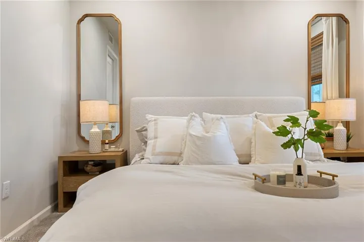 Carpeted bedroom featuring baseboards