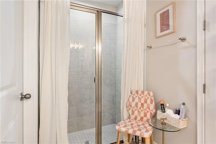 Full bathroom with a shower stall