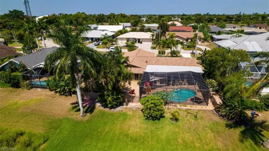 Nicely landscaped pool home in in area of pool homes