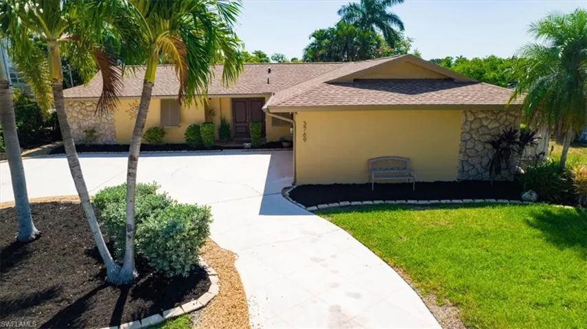 Front of home with circular driveway