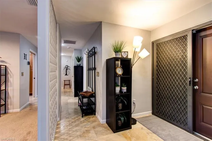 Welcoming entry with inside locking decorative screens.