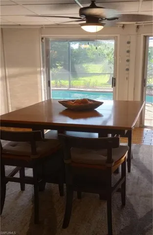 Pool view from any of the  sliding glass doors (with beautiful window treatments in your dining room