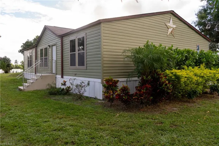 View of home's exterior featuring a lawn