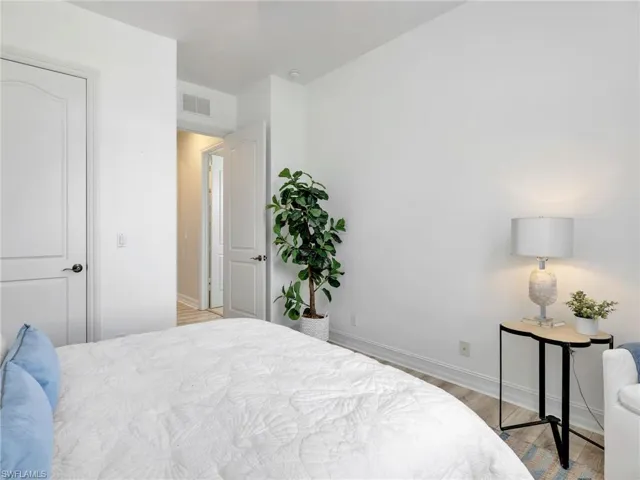 Bedroom featuring light wood-style flooring and baseboards