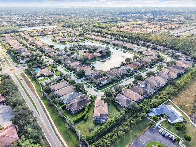 View of property location with a large body of water and nearby suburban area