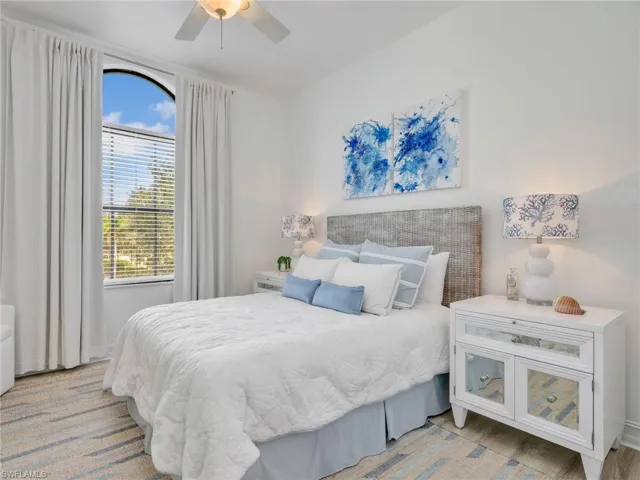 Bedroom with a ceiling fan and wood finished floors