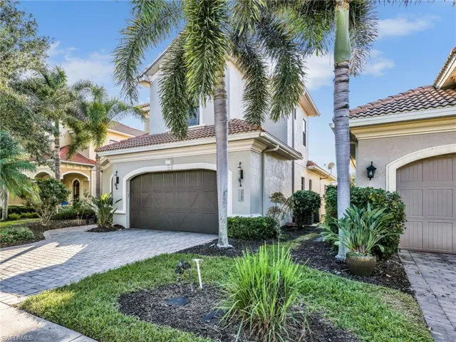 Mediterranean / spanish-style home featuring stucco siding, an attached garage, decorative driveway, and a tile roof