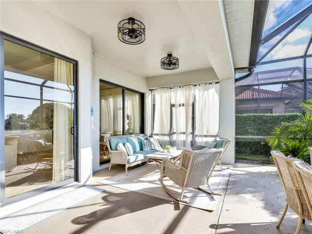 Sunroom featuring healthy amount of natural light and unfinished concrete floors