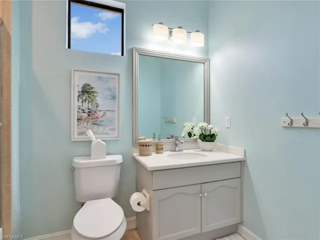 Full bath featuring vanity and a tile shower