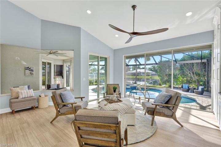 Plenty of room next to island for enjoying the outdoor views of the lake and pool through the new seamless panoramic pool screen.