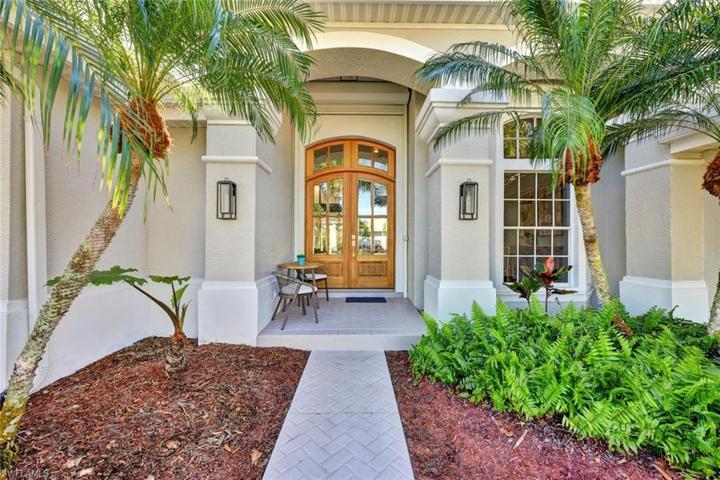Enter this gorgeous home though oversized mahogany double doors.