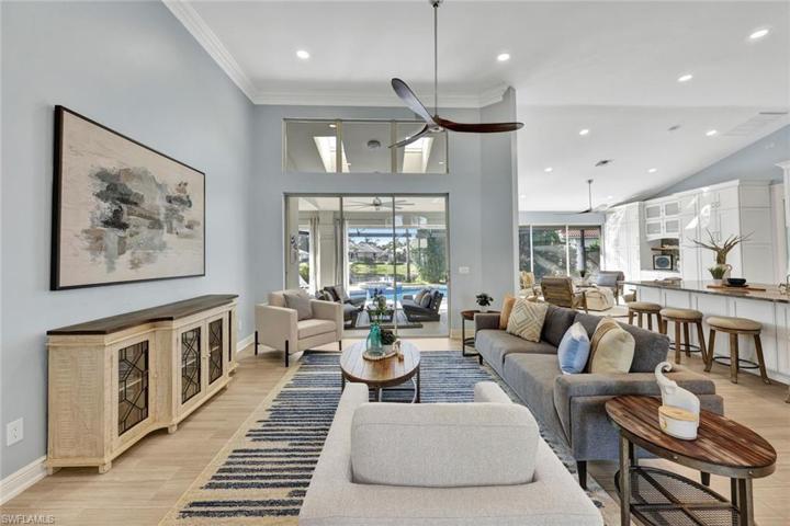 Open concept living with extended high ceilings and tile floors throughout home.