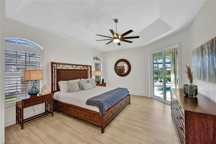 Spacious Primary Bedroom with sliding doors that lead to lanai.