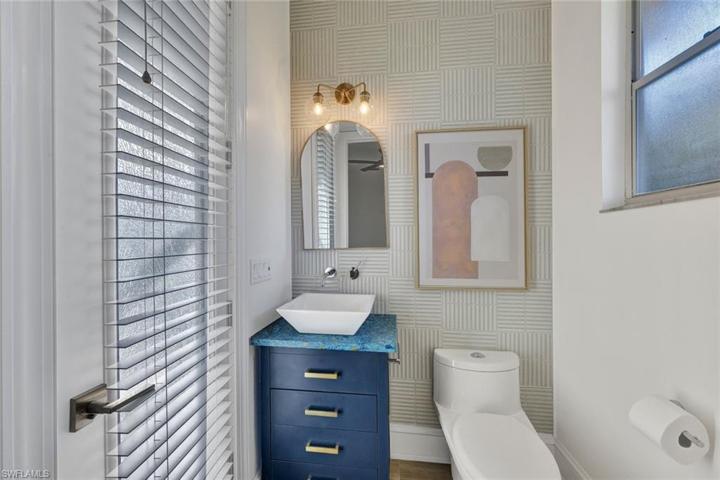 This bathroom doubles as the pool bahroom.