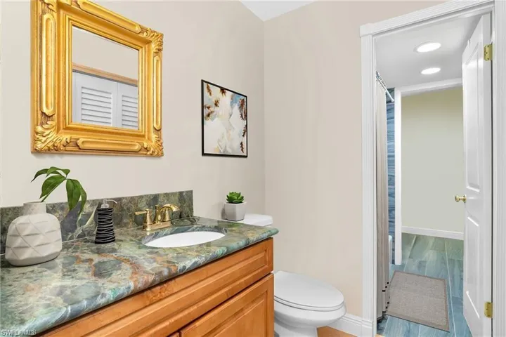 Half bath featuring vanity and toilet