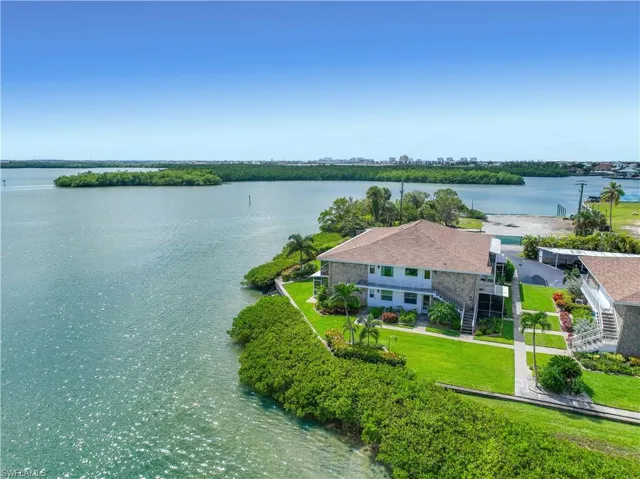 View from above of property with a nearby body of water