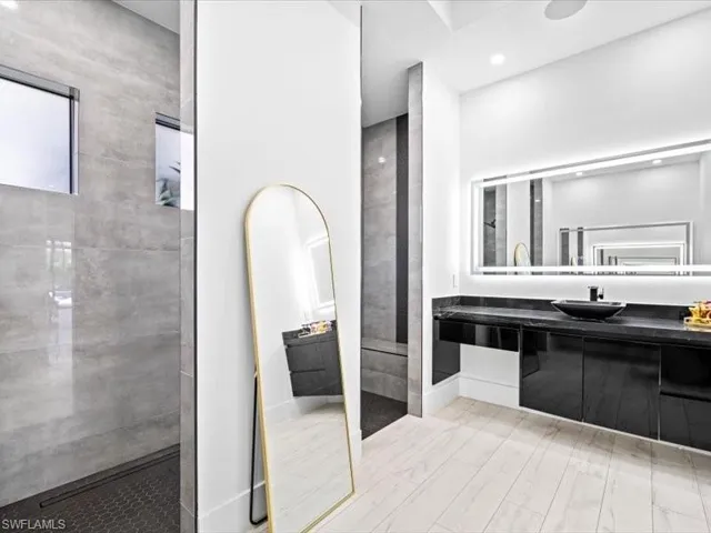 Bathroom with vanity and a walk in shower