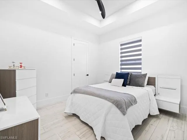 Bedroom featuring light wood finished floors and a ceiling fan