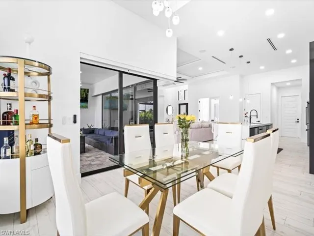 Dining space with recessed lighting and light wood finished floors