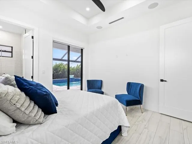 Bedroom with a sunroom, access to exterior, recessed lighting, and ceiling fan