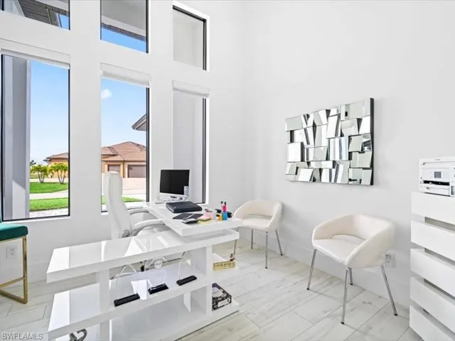 Office area featuring a high ceiling