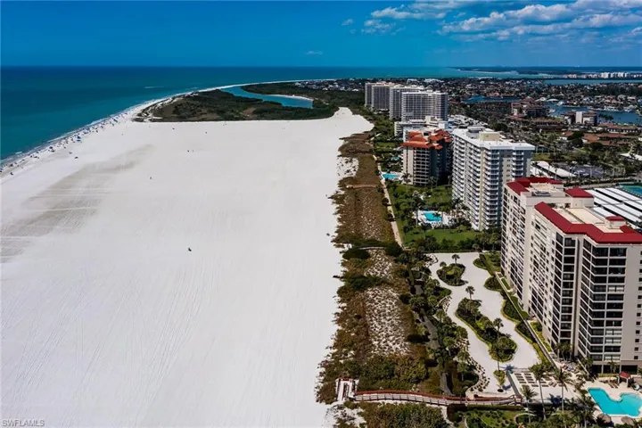 Aerial view with a view of city, a water view, and a view of the beach