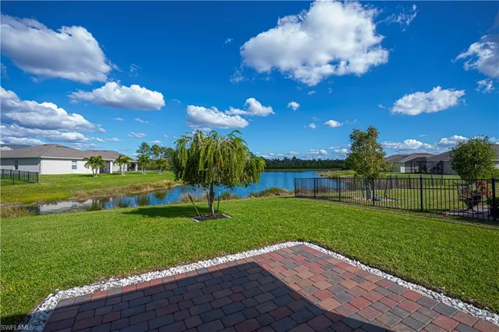 end of the extended pavers just just in front of your screened in lanai with pond view.