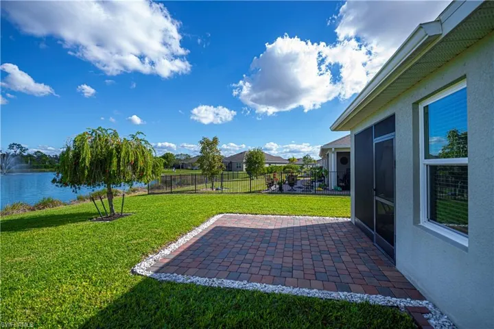 Back of Lanai view with extended pavers and landscape curbing