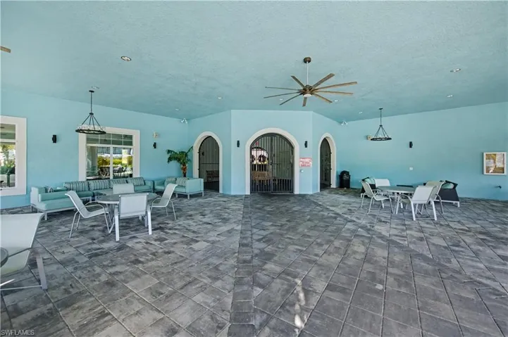 recreational area just in front of the pool that is shaded
