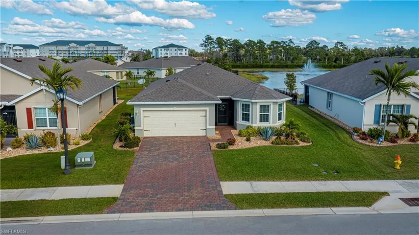 2019 Beauty with freshly cleaned & sealed pavers and pond view.