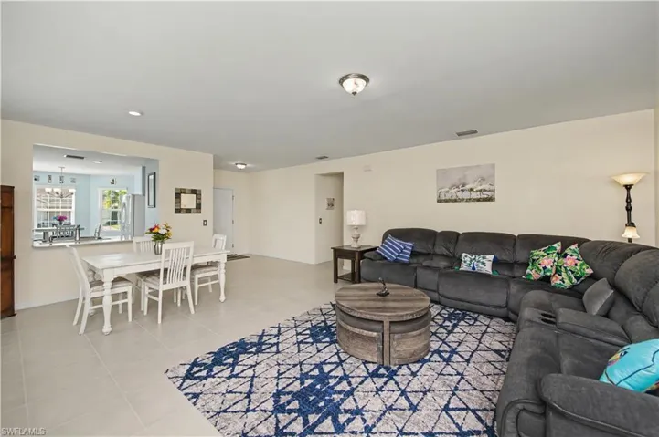 view from the back of the great room toward the kitchen and front entry of home