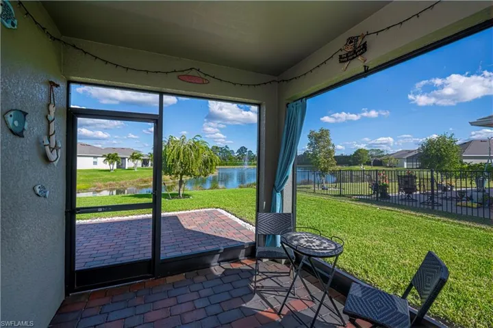 screened in lanai with extender pavers & pond view