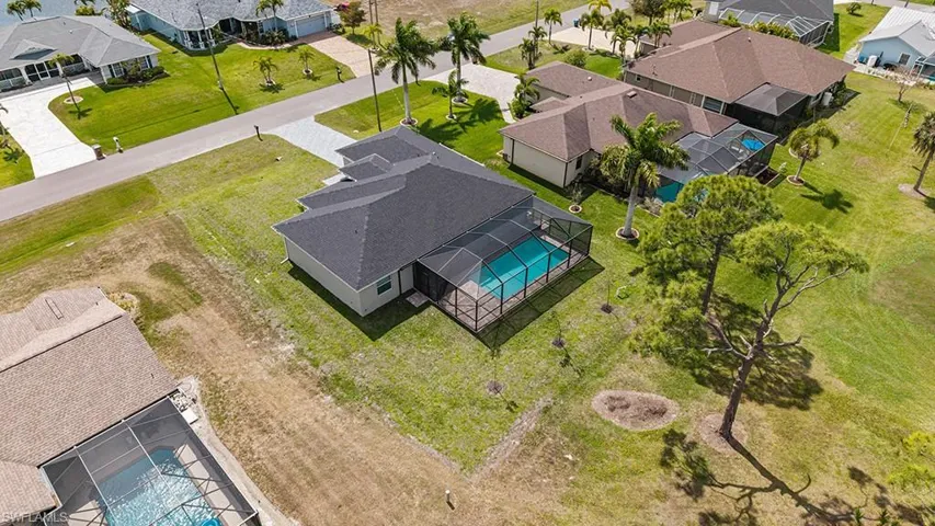 Aerial perspective of suburban area with a pool area