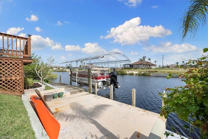 Large area by dock provides another great outdoor space. There's a ramp on side of dock for easy launching of kayak