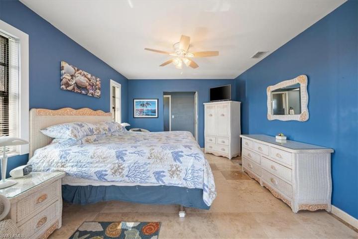 Master has lots of room for King size bed and more and has view of pool and water via sliding doors.