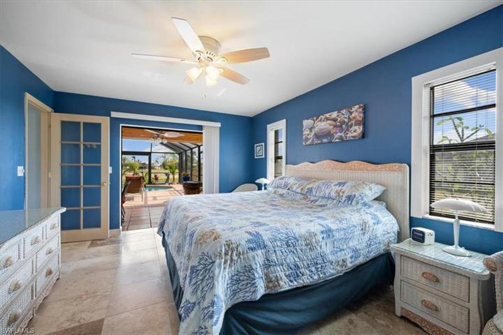 Master has lots of room for King size bed and more and has view of pool and water via sliding doors.