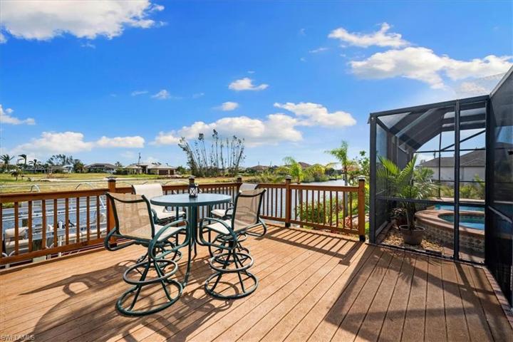 2 HUGE deck areas. This one is elevated and outside but connected to the cage. Both overlook the gorgeous water view.