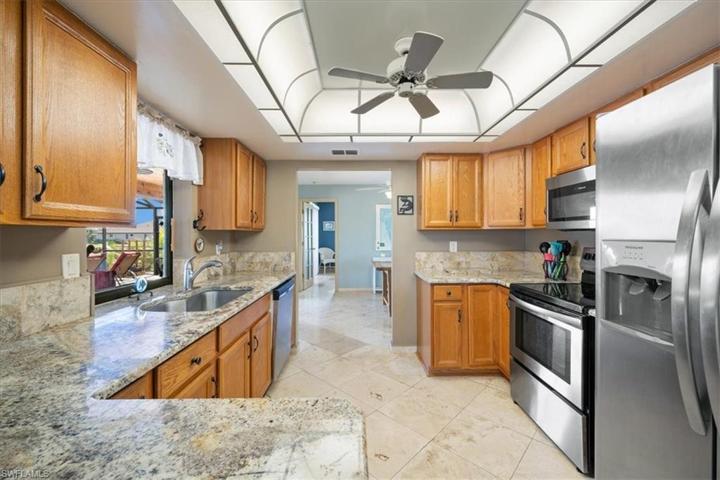 Kitchen remodeled with upscale granite and stainless steel appliances