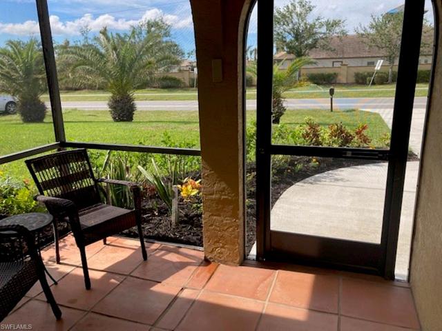 Beautiful, large entrance has large screened sitting area.