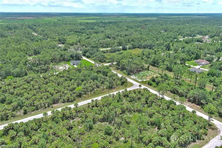 View of property location featuring a heavily wooded area