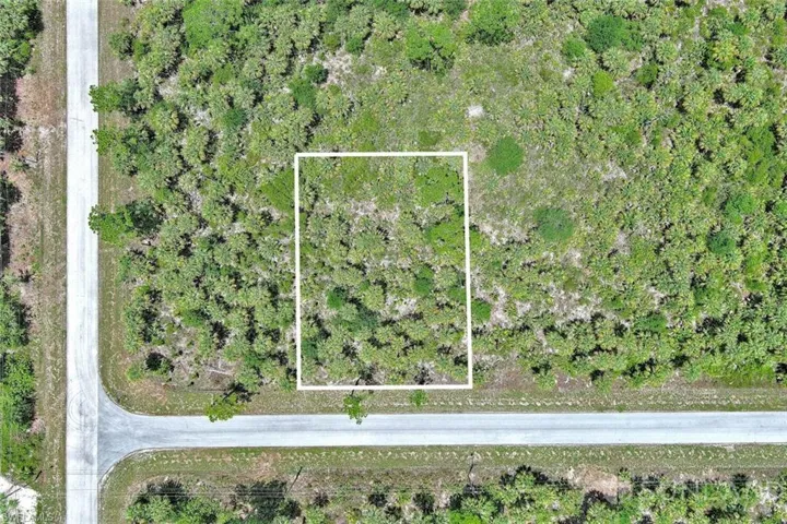 Aerial overview of property's location featuring property parcel outlined