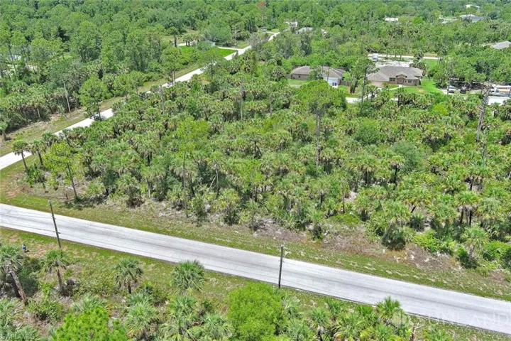 Aerial overview of property's location featuring a forest