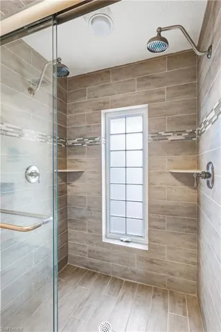 Full bathroom featuring a stall shower