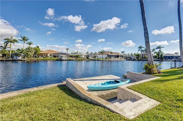 Dock area featuring a residential view, a water view, and a yard