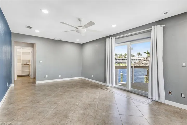 Empty room with baseboards, visible vents, a ceiling fan, and recessed lighting