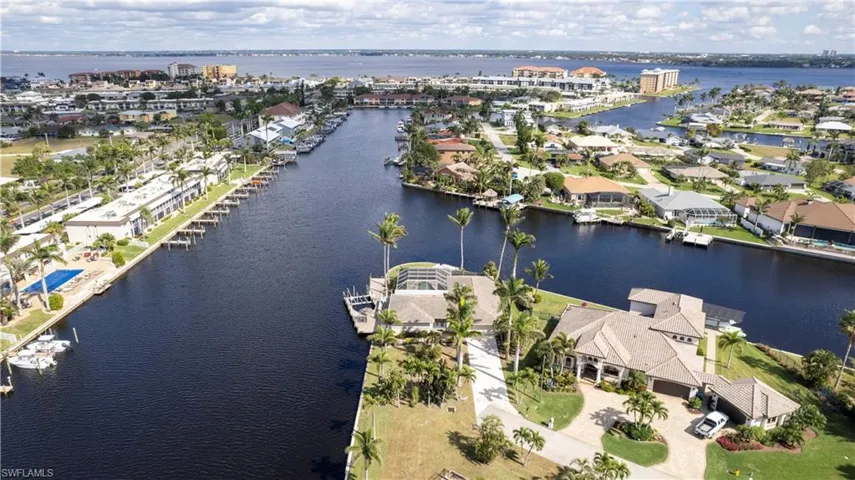 Aerial view featuring a water view and a residential view
