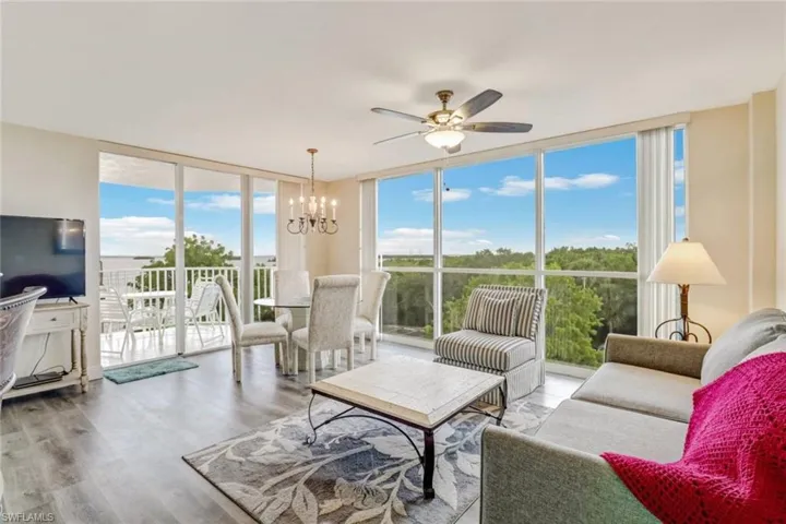 Sunroom featuring a chandelier
