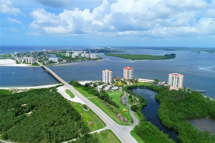 View of urban area featuring a nearby body of water and a notable bridge