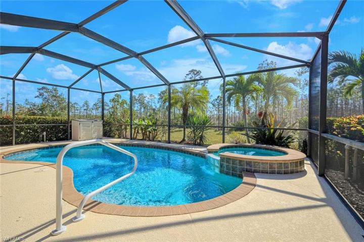There are so many desirable spaces in this home, beginning with this fabulous pool and spa overlooking a gorgeous preserve.
