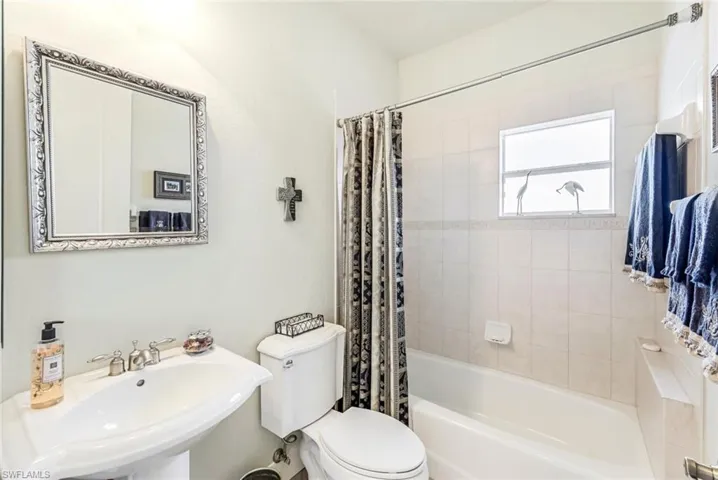 Full bathroom with sink, shower / bath combo